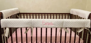 Minky dot rail covers shown on crib